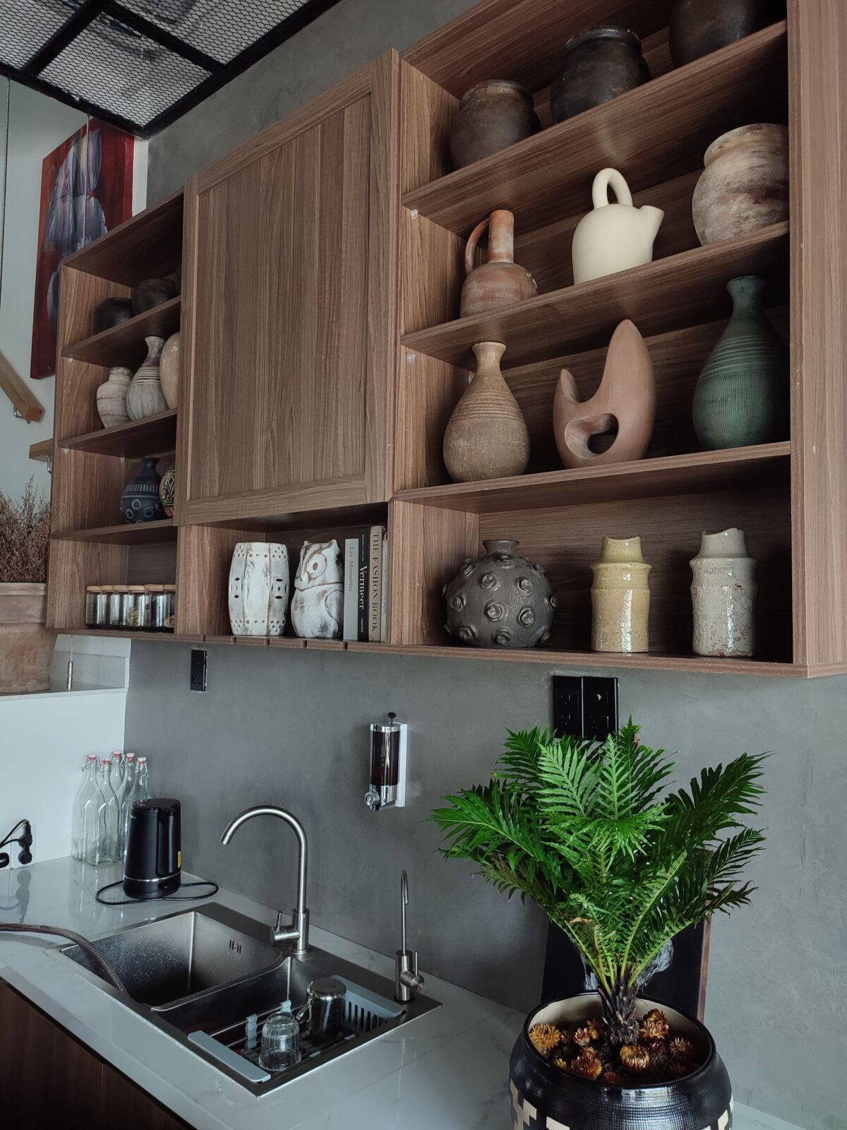 Wooden kitchen drawers beside a sink