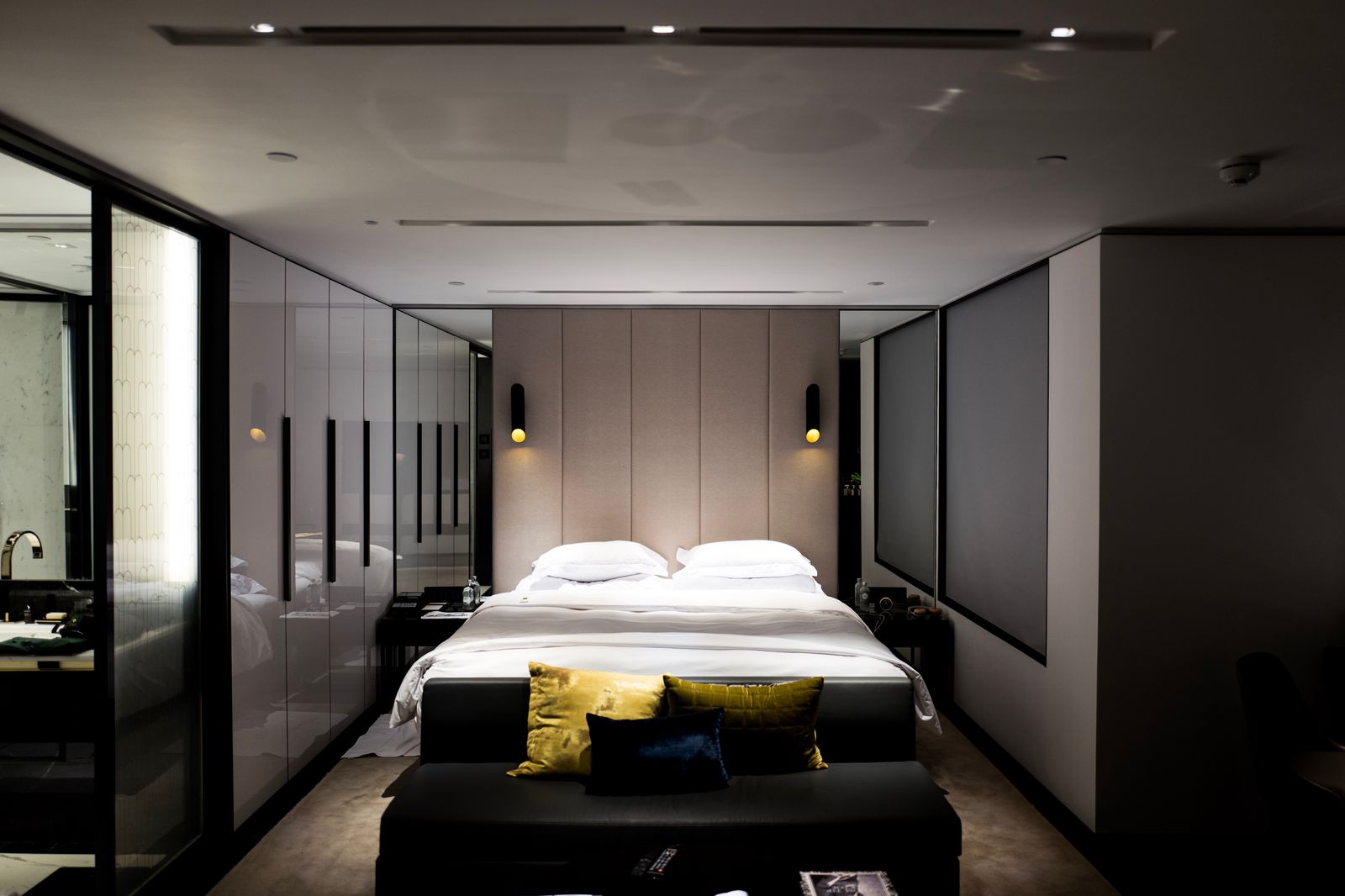 Neatly made bed with white bed sheets and pillowcases