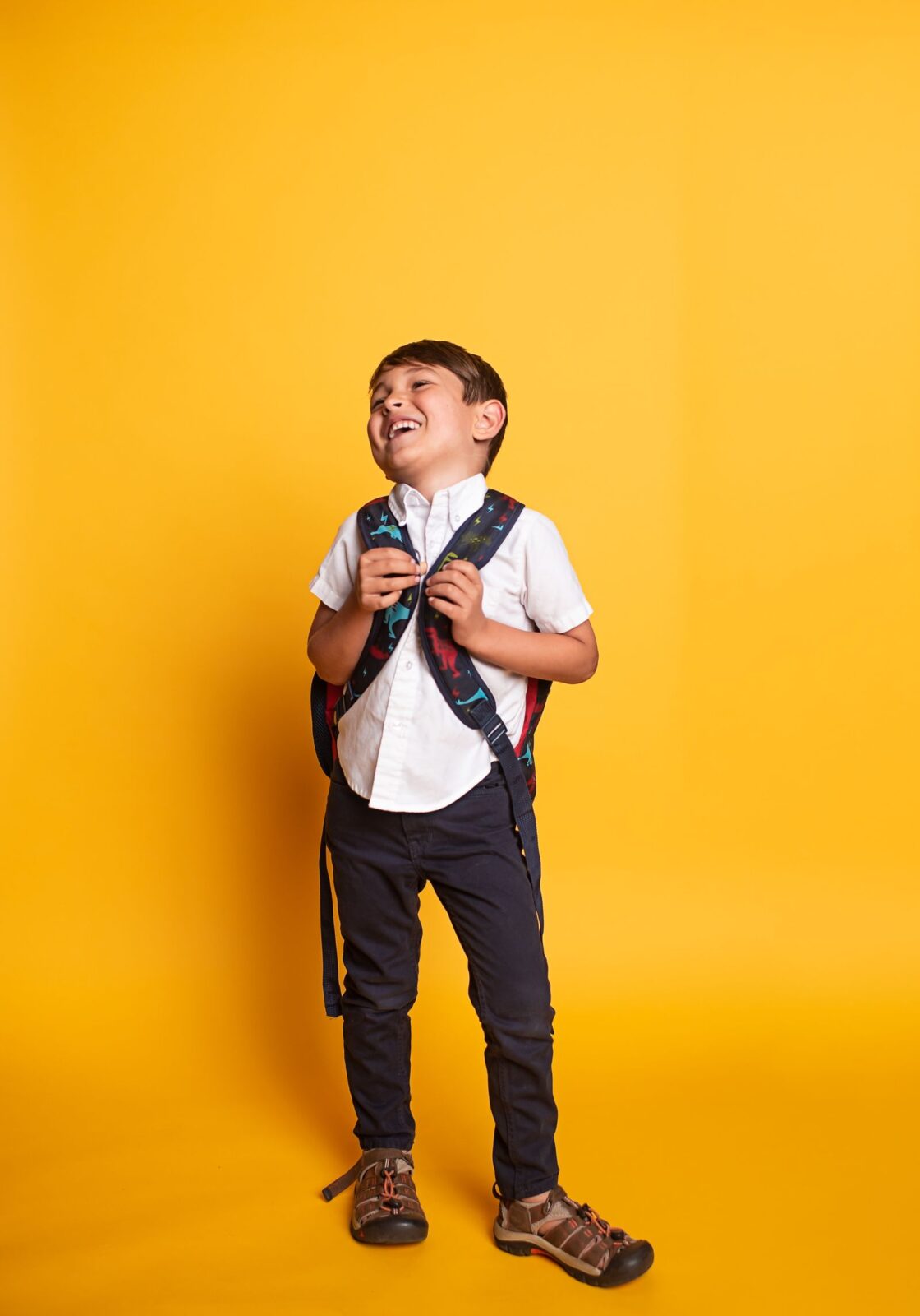 Child wearing a school backpack