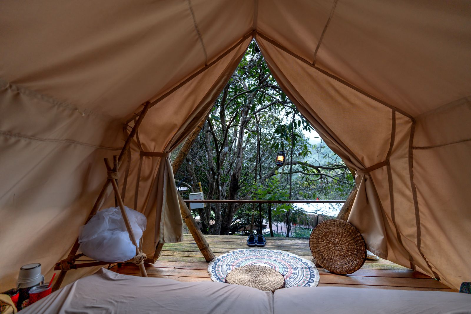 An ultralight backpacking quilt over an inflatable pad in a tent