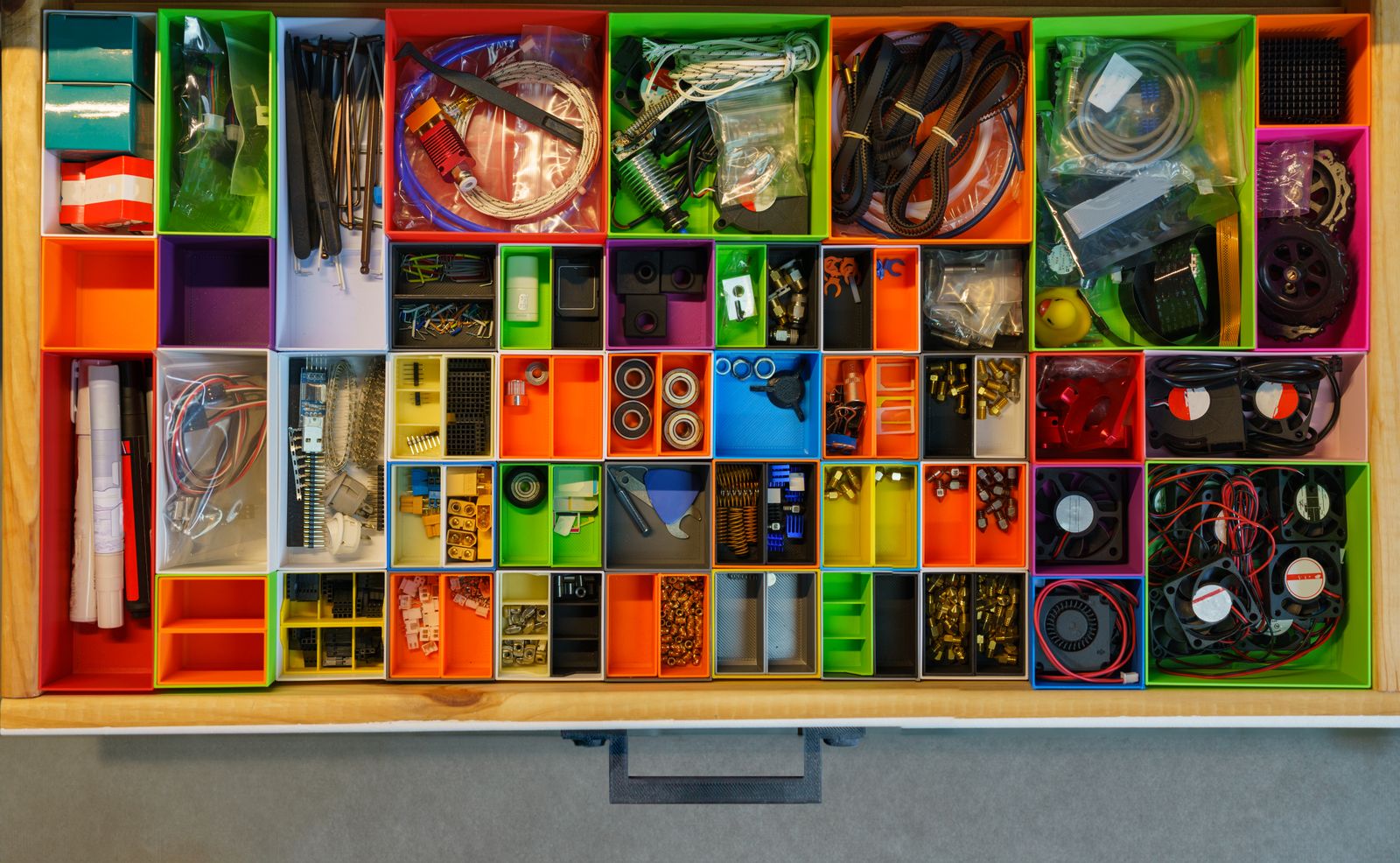 Open drawer organized with dividers separating items into sections