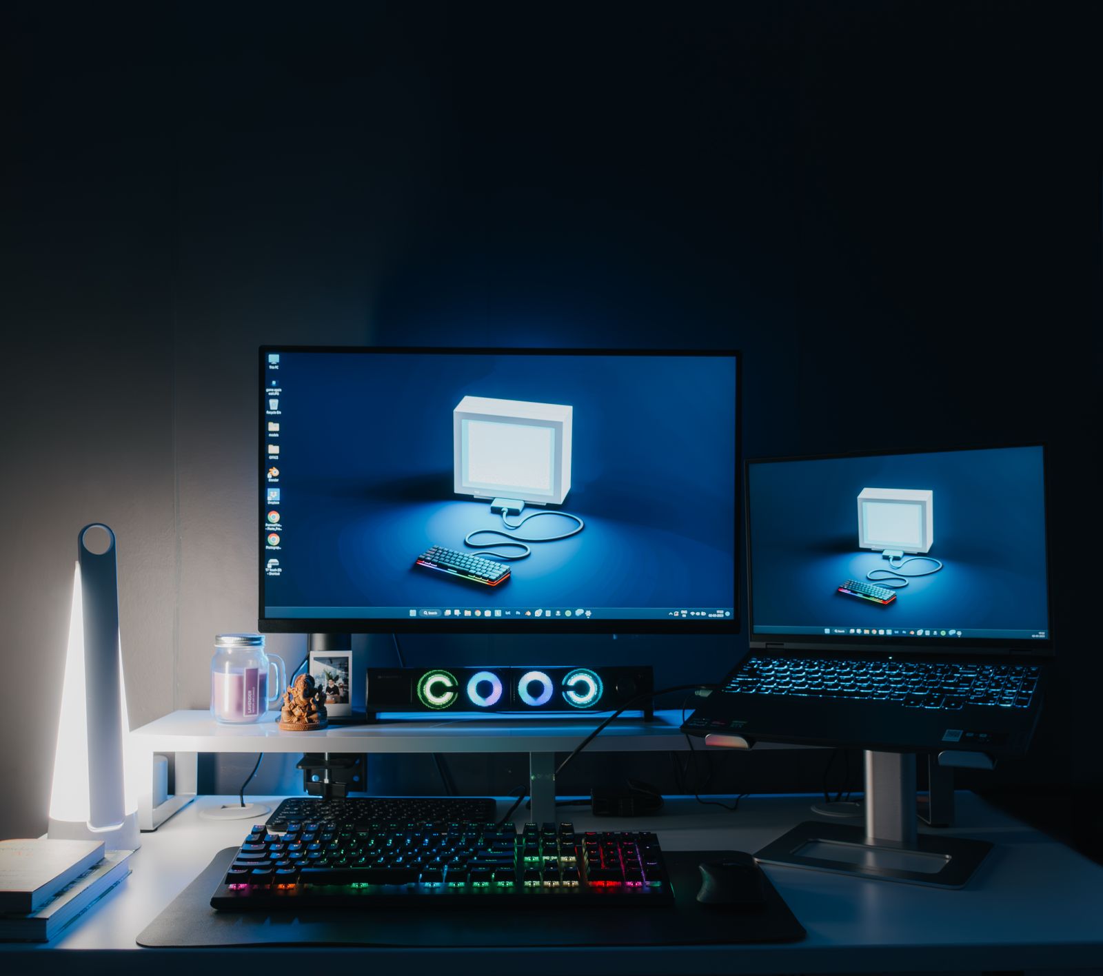Home office desk with two computer monitors and a keyboard