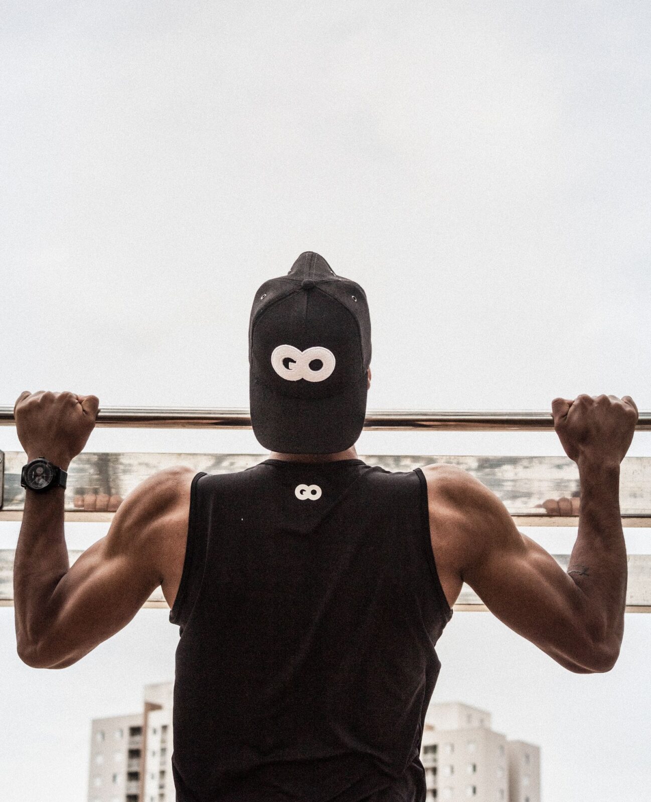 Person doing pull-ups on a power tower at home
