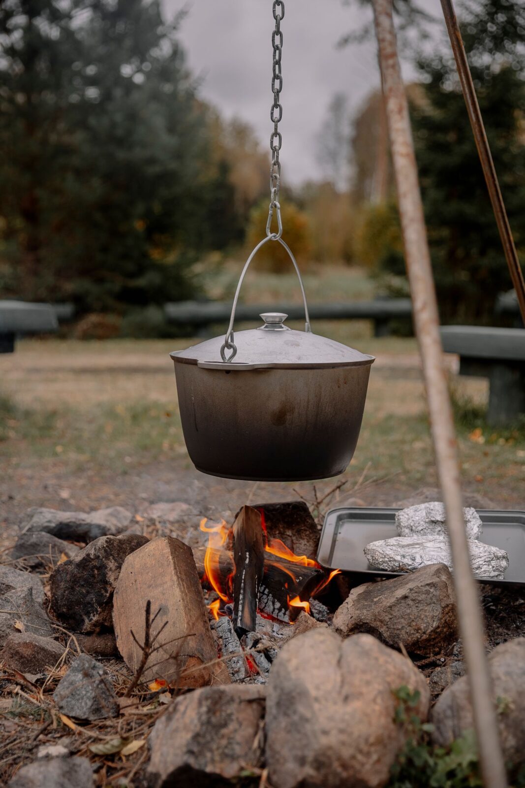 Cooking pot hanging over a wood campfire