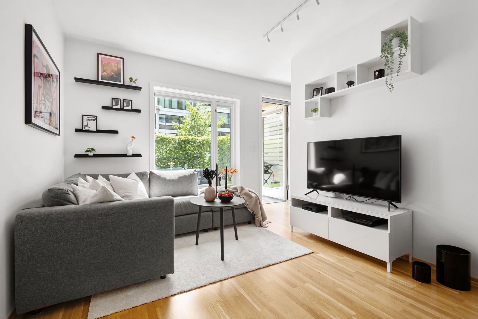 A soundbar and a wireless speaker set up for whole-home audio in a living room