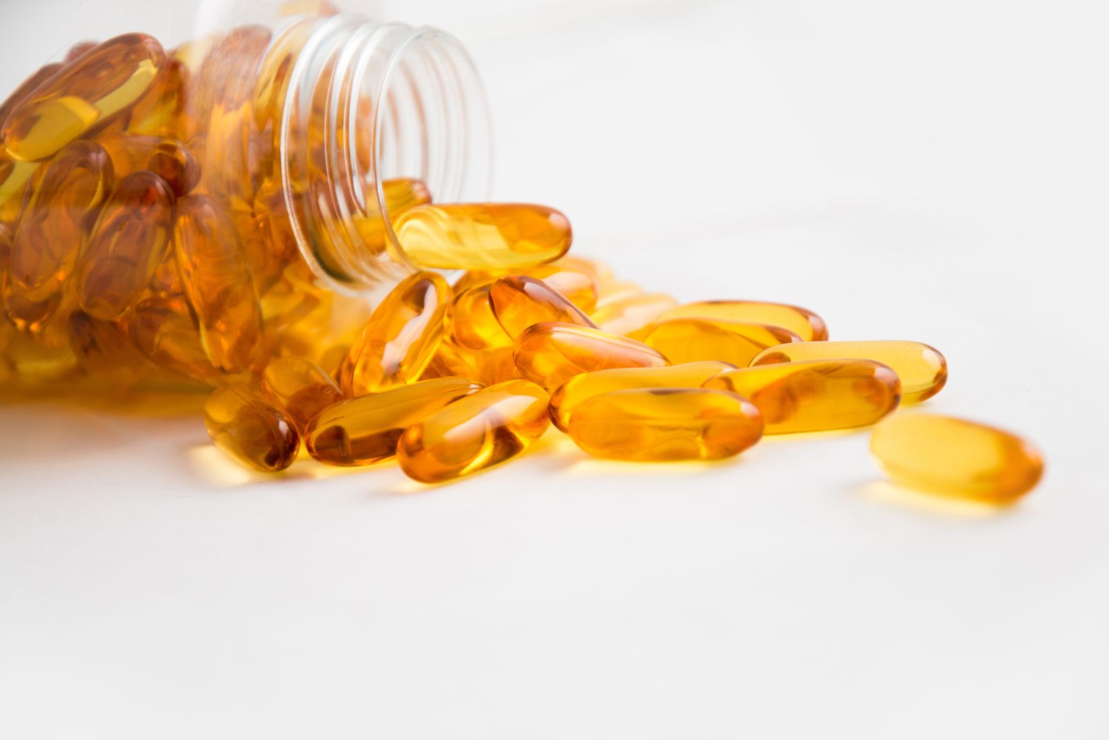 Softgel supplement capsules — omega-3 source comparison hero
