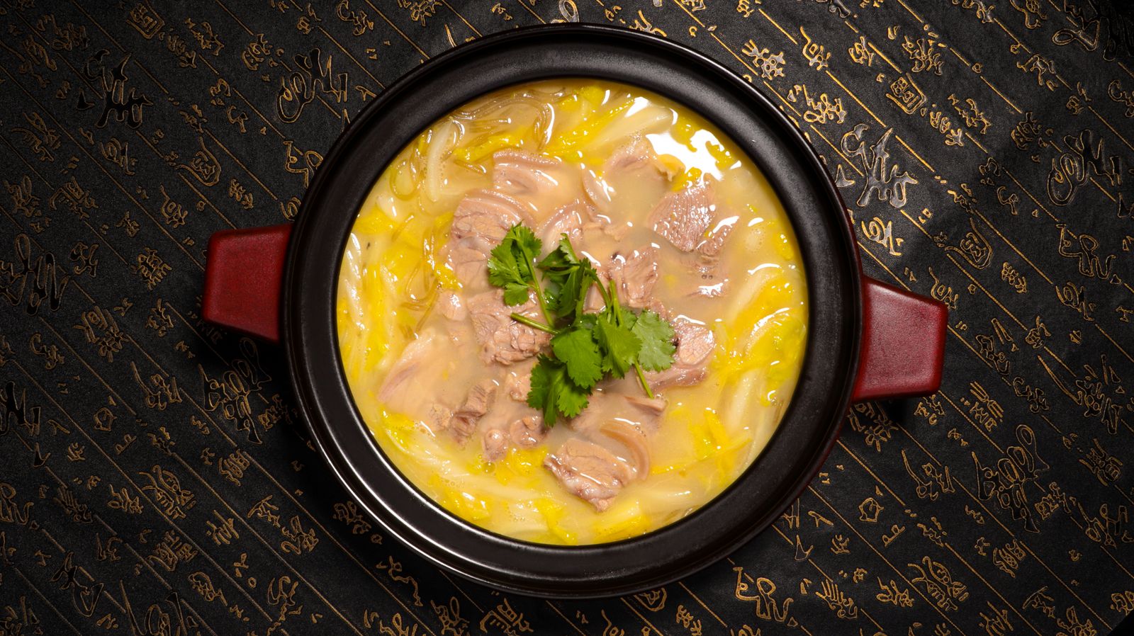 A hearty meat stew cooking in a pot