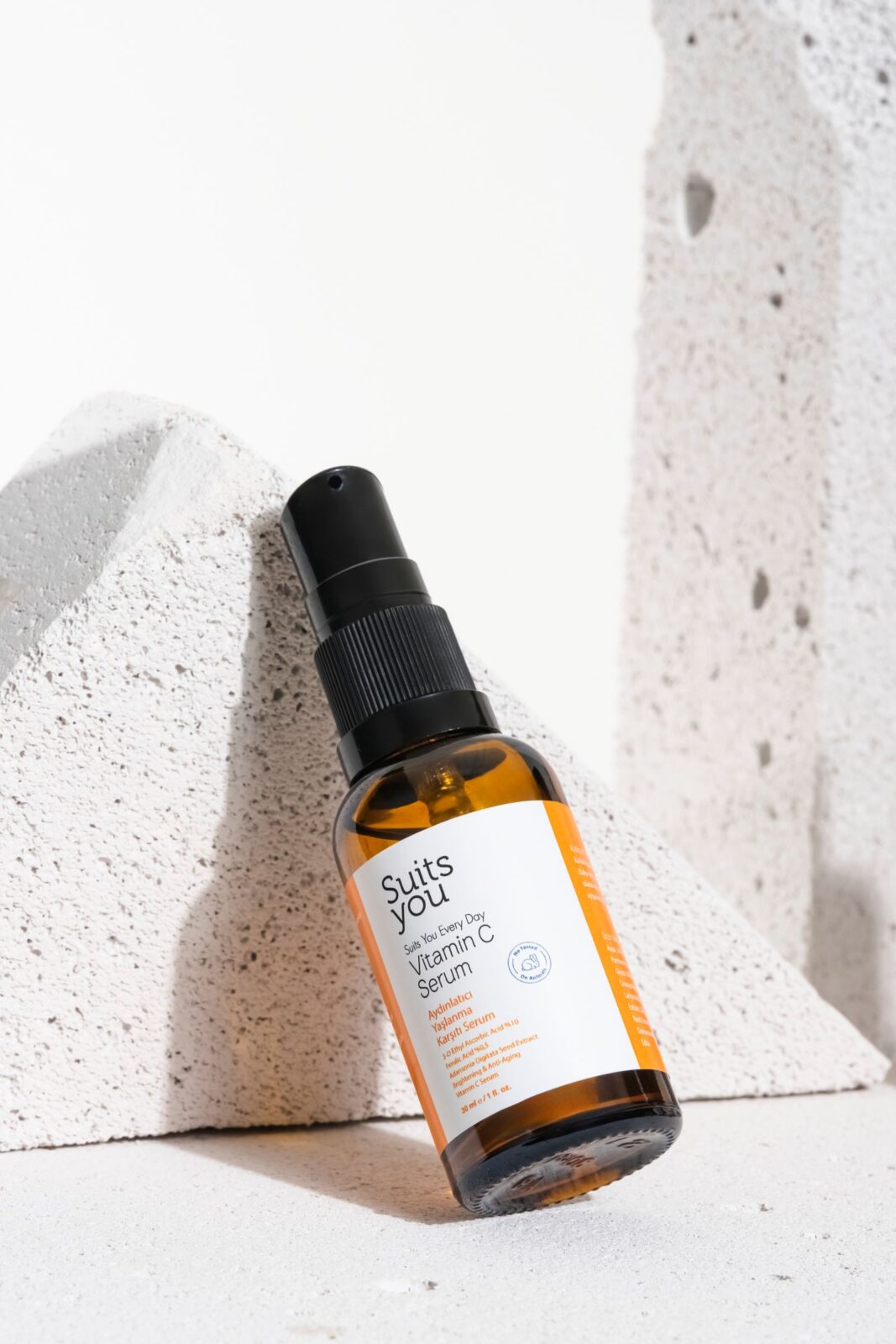 Vitamin C serum bottle with dropper on a clean minimalist surface