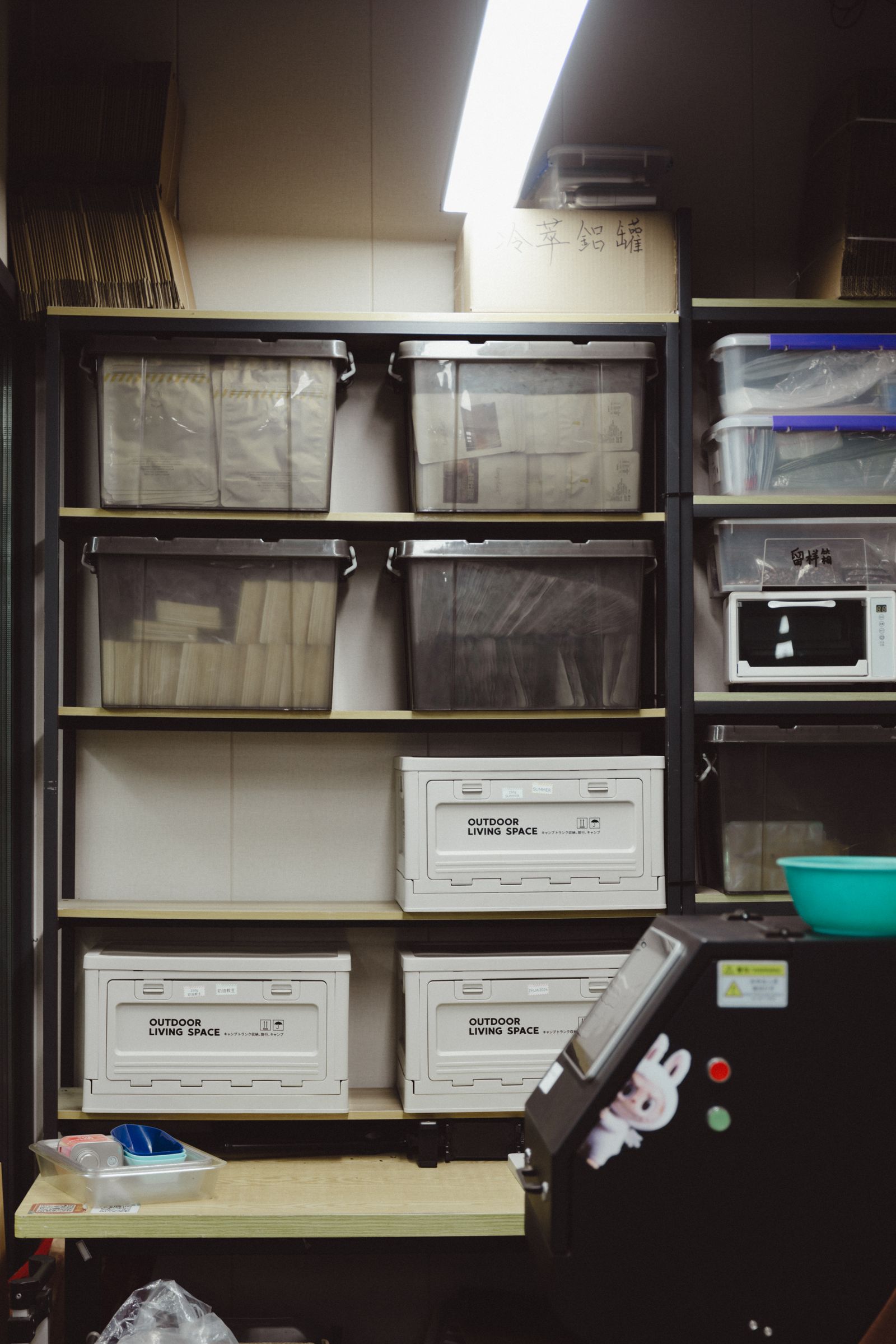 Organized storage room with plastic containers arranged on shelves