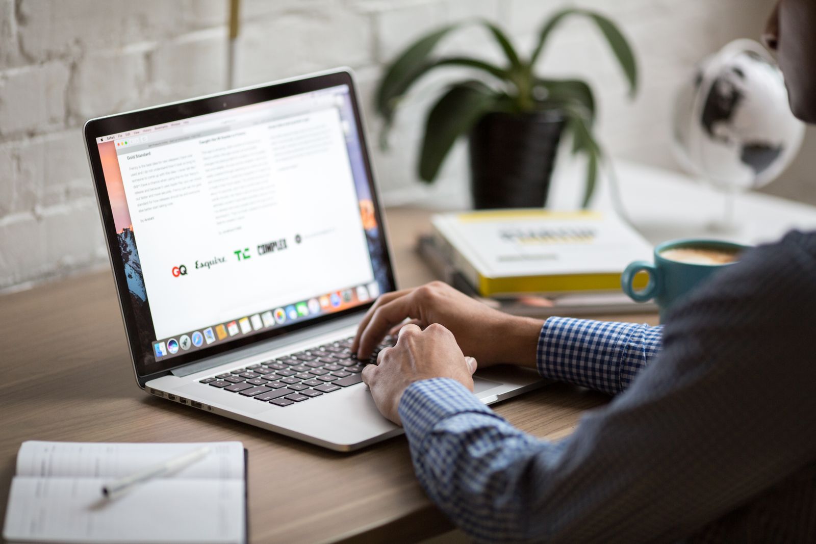 Computer workspace on a home office desk — monitor resolution comparison hero