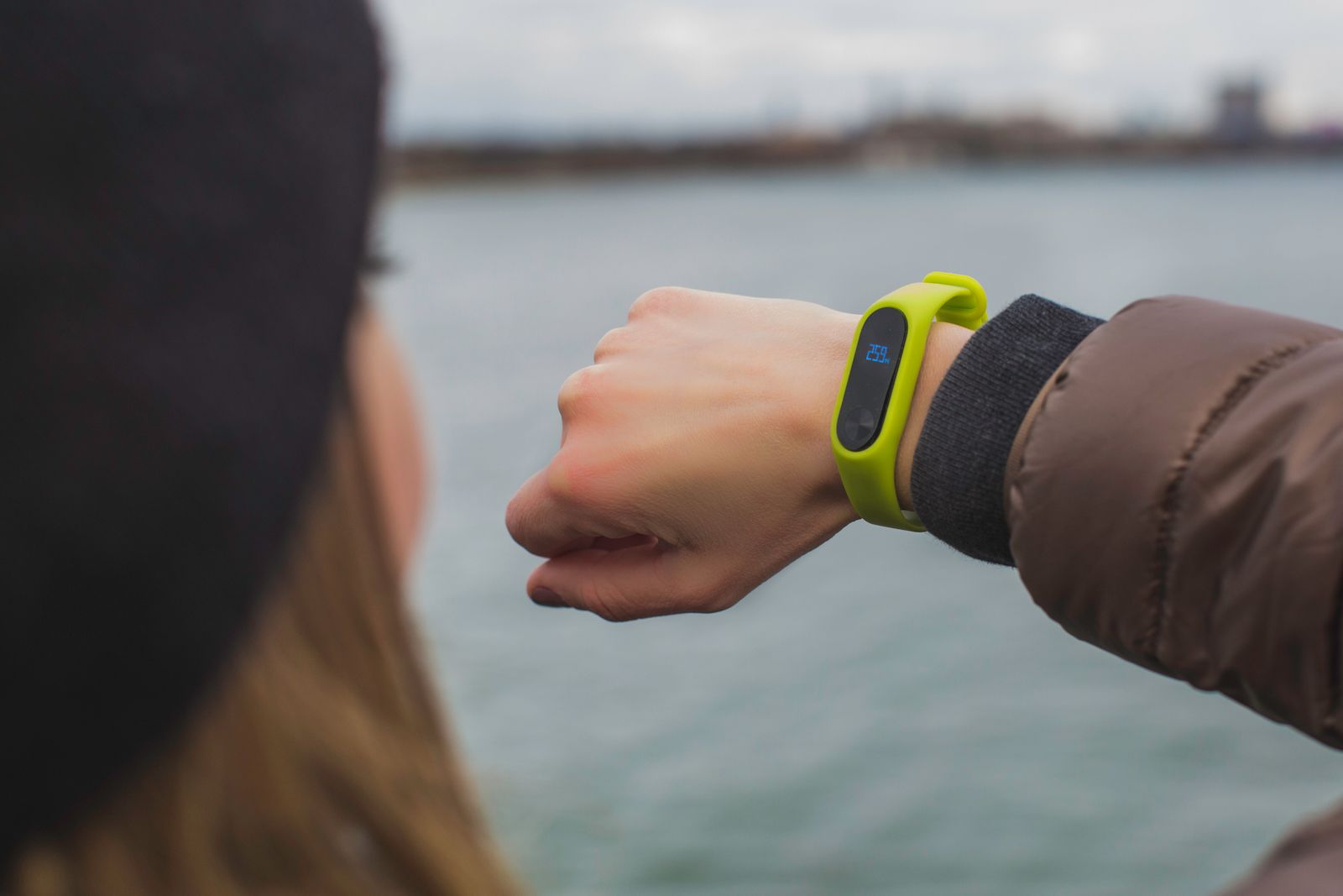 An active person checking the sport watch on their wrist
