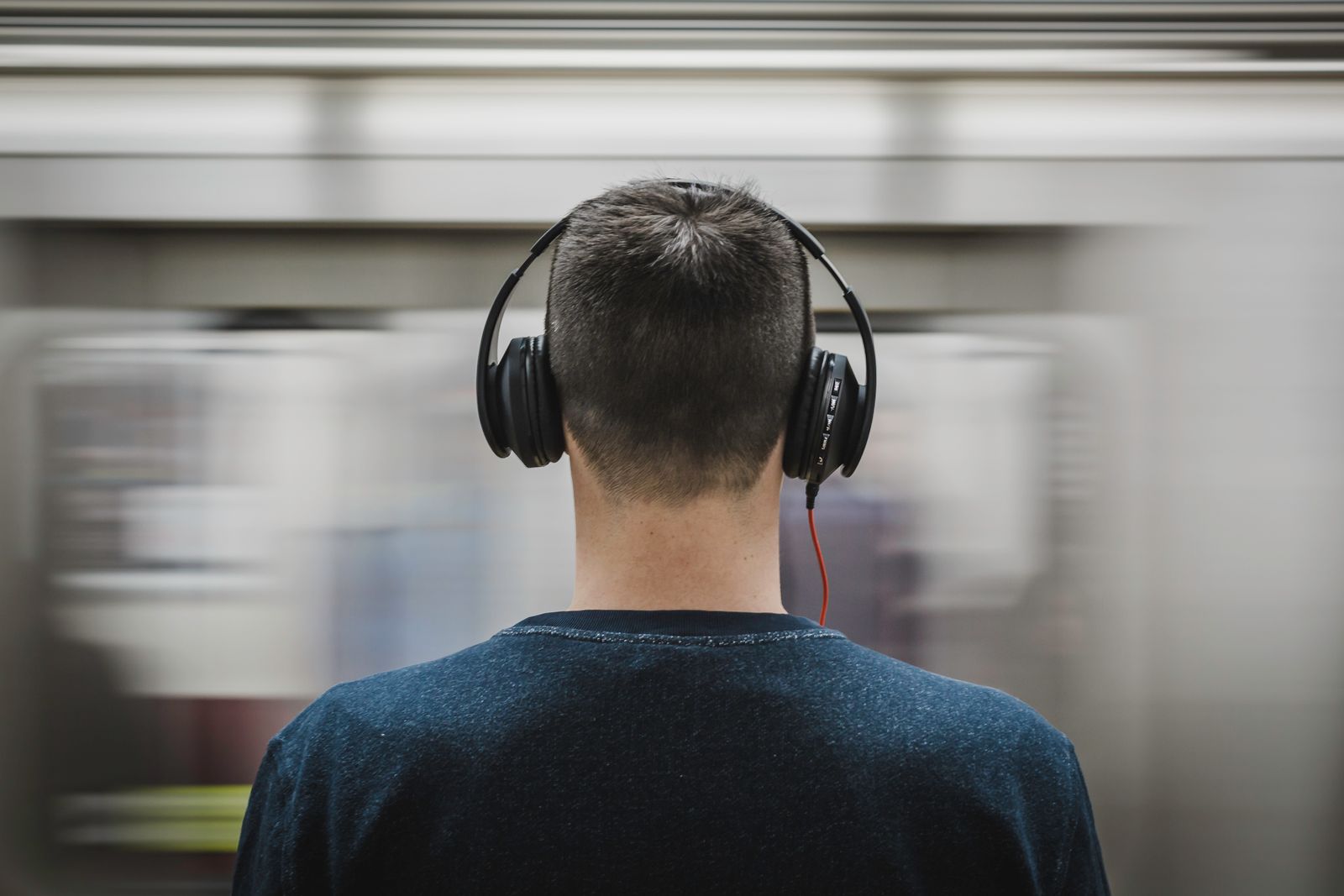 Person comfortably wearing over-ear headphones during a long listening session