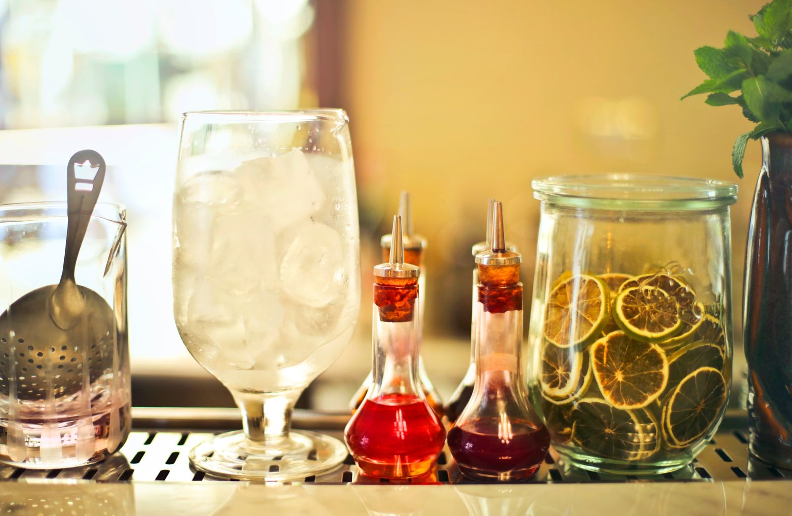 A glass filled with ice on a kitchen counter