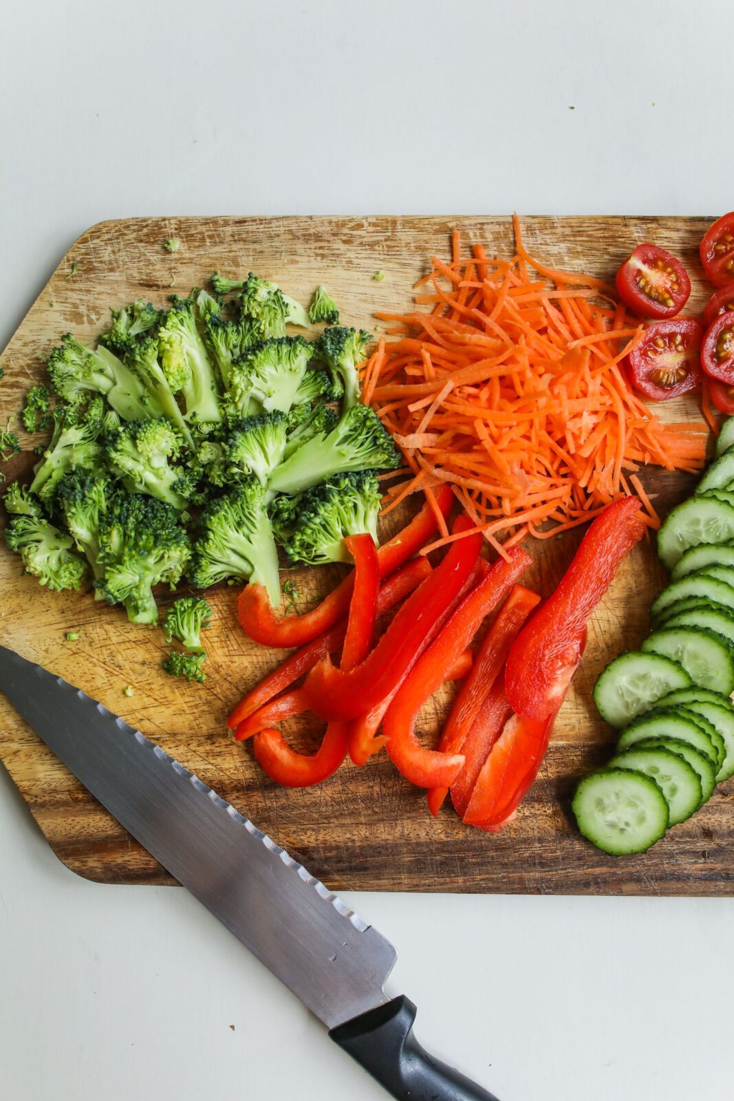 Freshly sliced vegetables on a wooden board