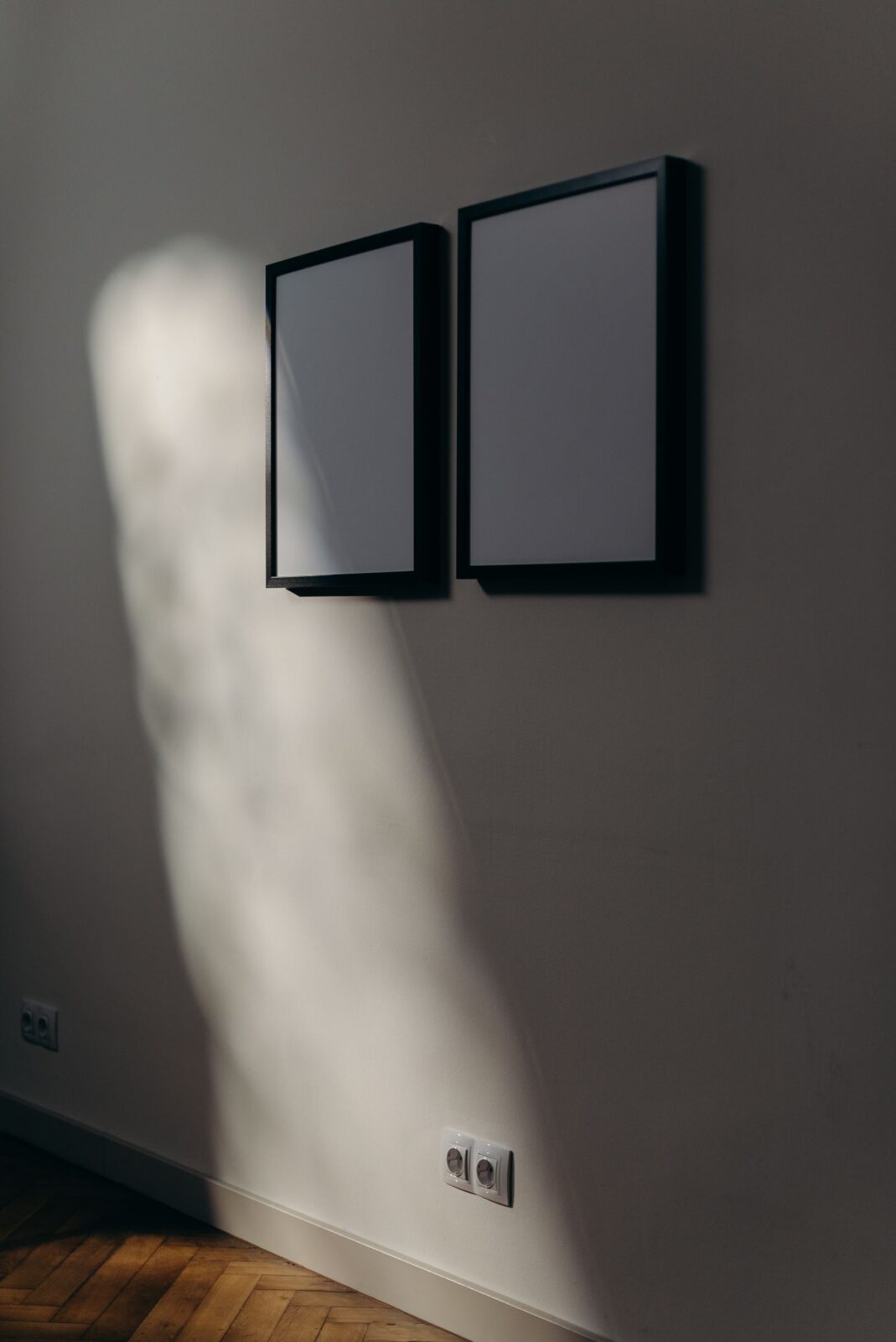 A slim modern soundbar on a console beneath a wall-mounted TV