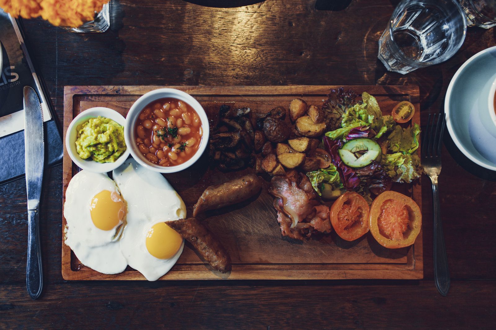 A mix of vegetables, egg, beans and sausage cooked together