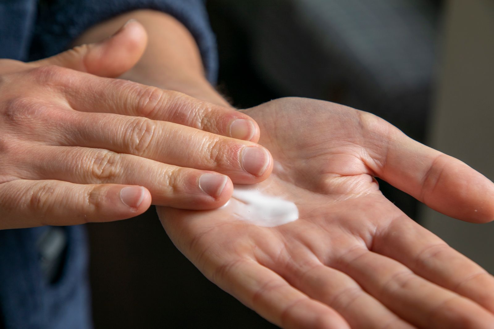 Rich foaming cleanser lather in a person's hands