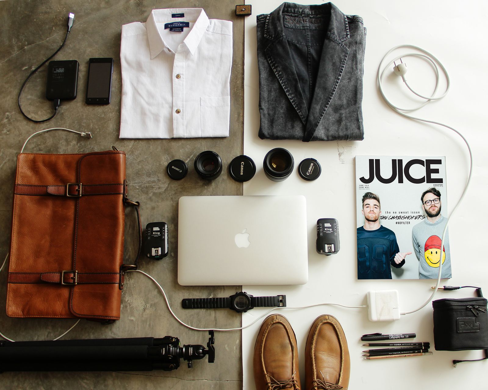 Open travel backpack showing organized compartments with a laptop and gadgets