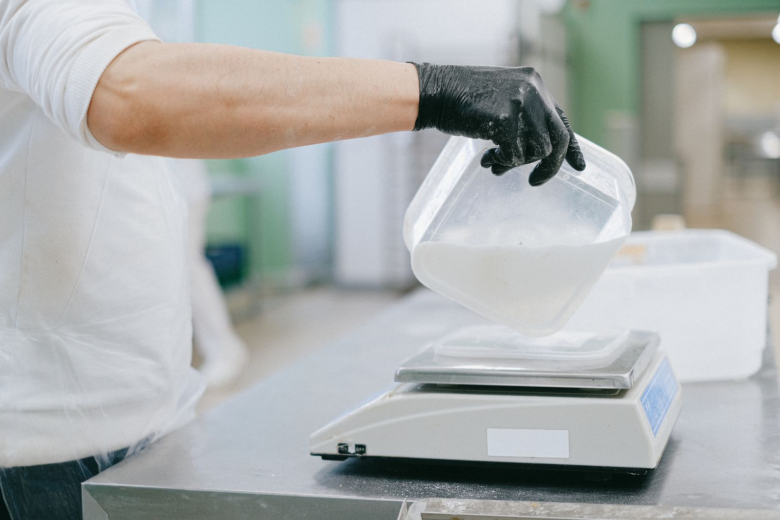 A digital kitchen food scale weighing fresh food to the gram