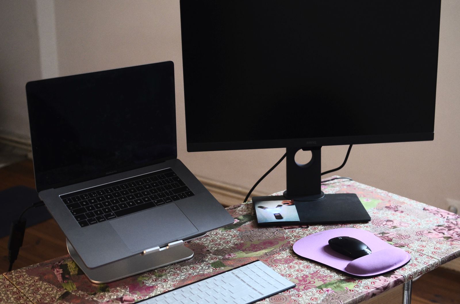 A laptop and a second monitor set up on a desk