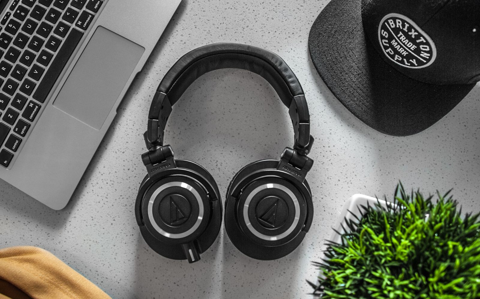 Premium over-ear wireless headphones on a minimalist desk