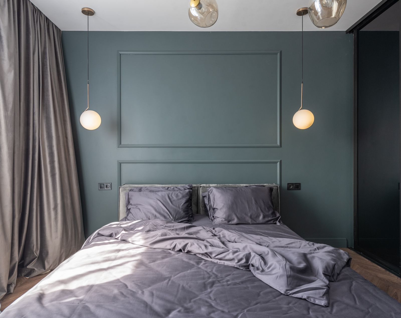 Cozy bedroom with a plush bed and duvet near a bright window