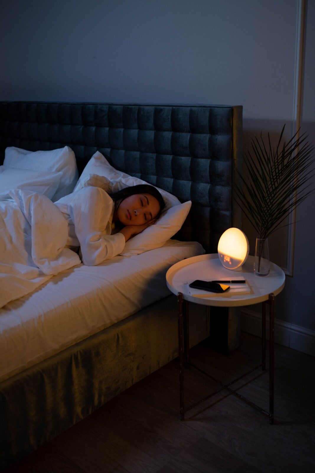 A person sleeping peacefully on their side with head on a pillow