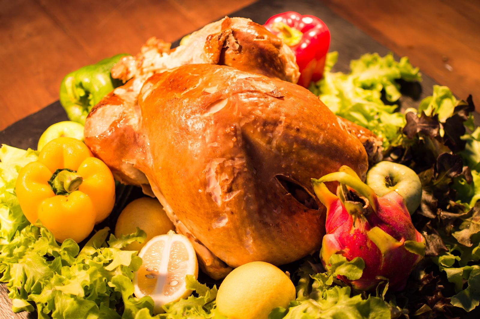 Large countertop oven roasting a chicken and vegetables for a family meal