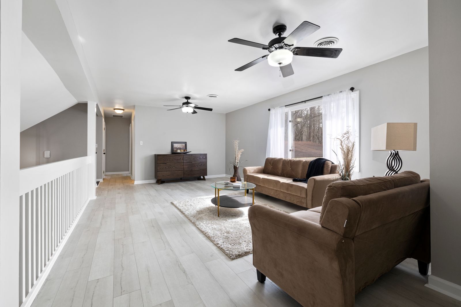 A clean living room with a wooden floor