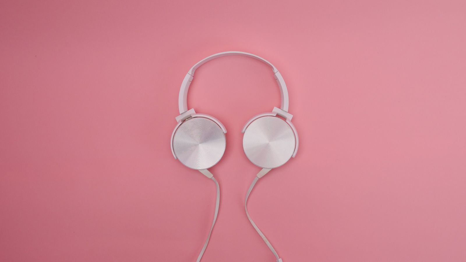 Pair of over-ear headphones resting on a surface