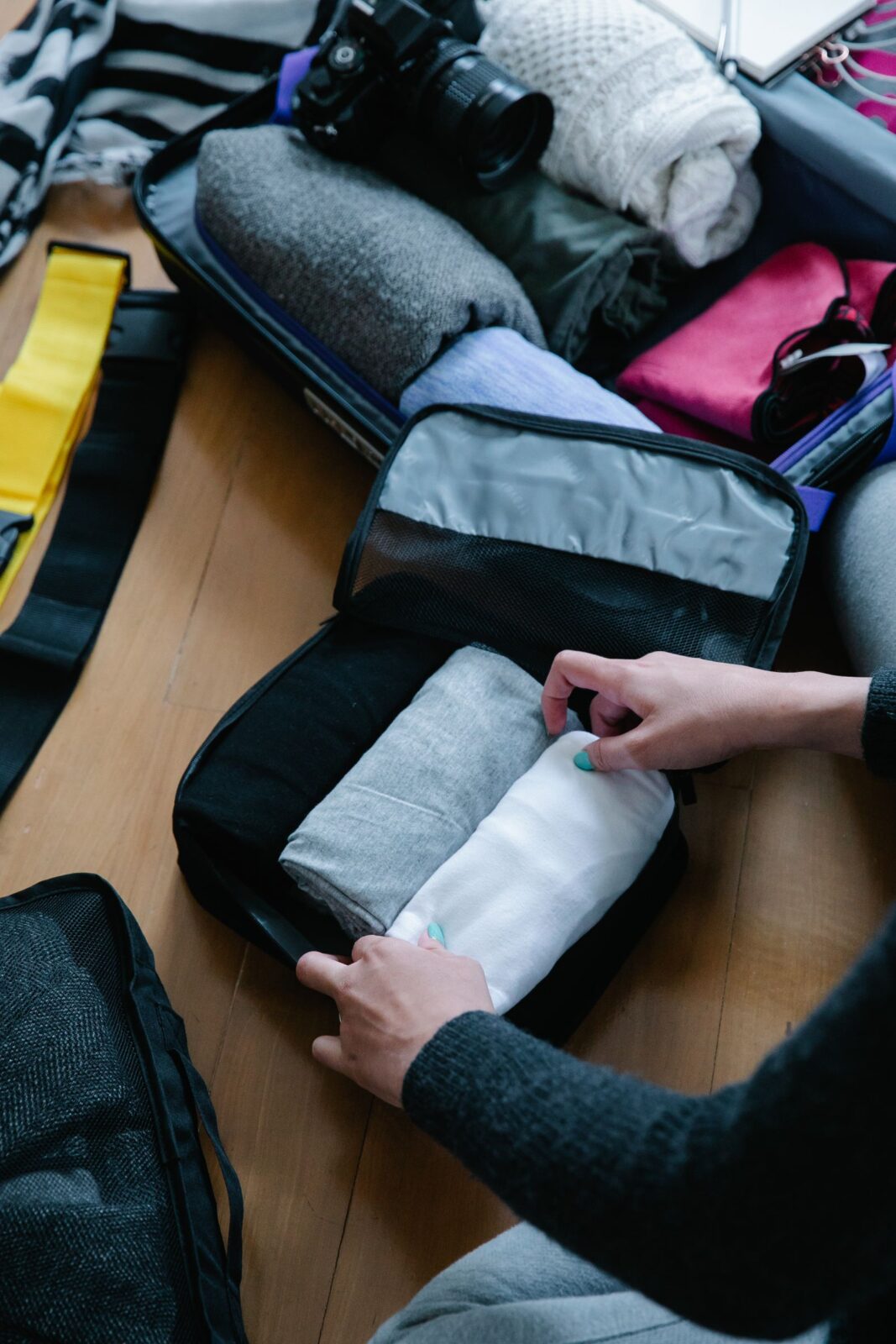 Folded clothes sorted into fabric packing cubes