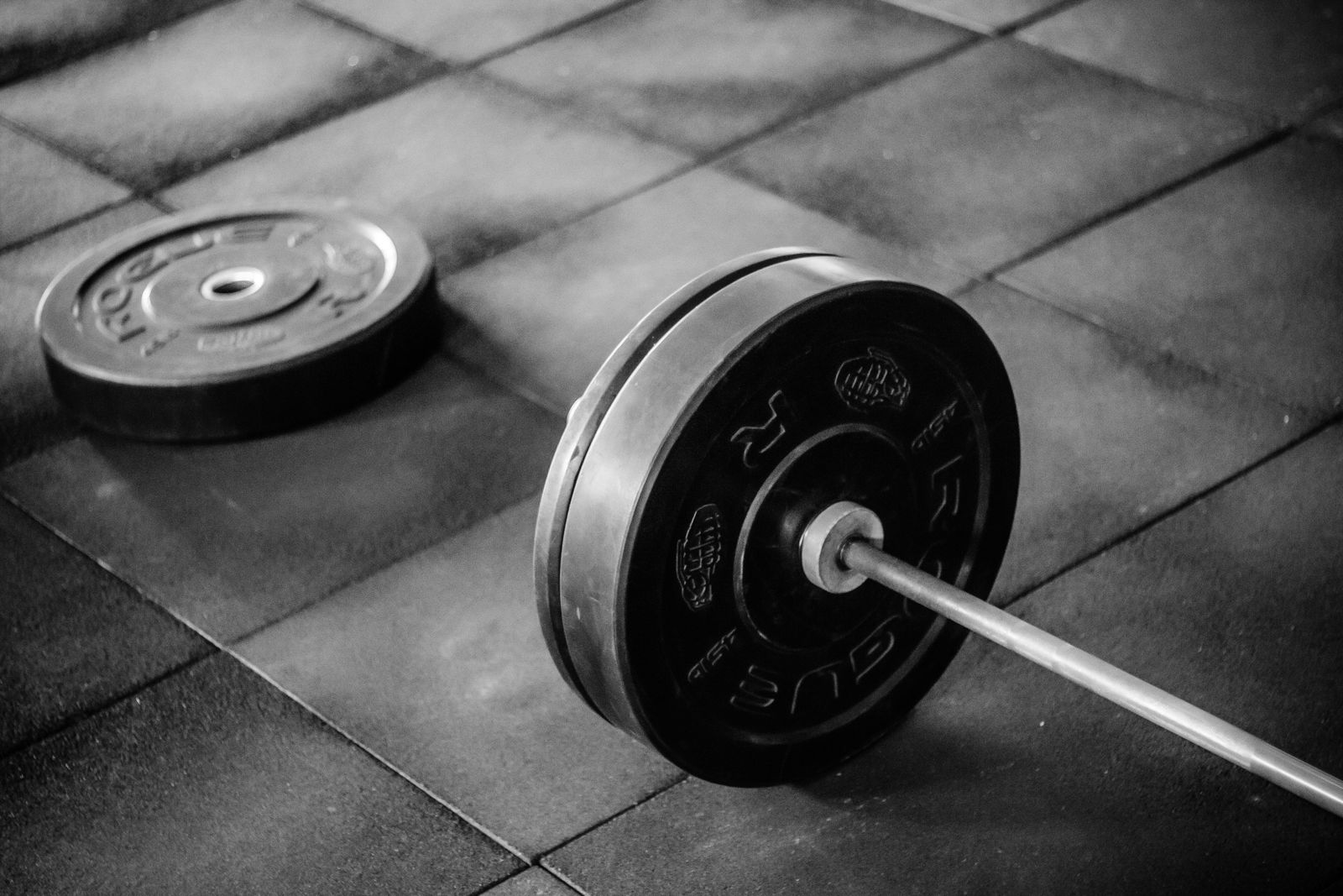 Adjustable dumbbell resting on the floor