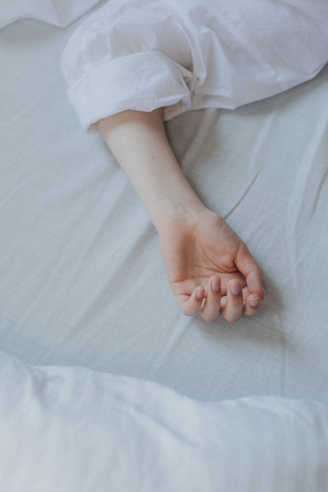 Hand pressing into a contouring memory-foam mattress