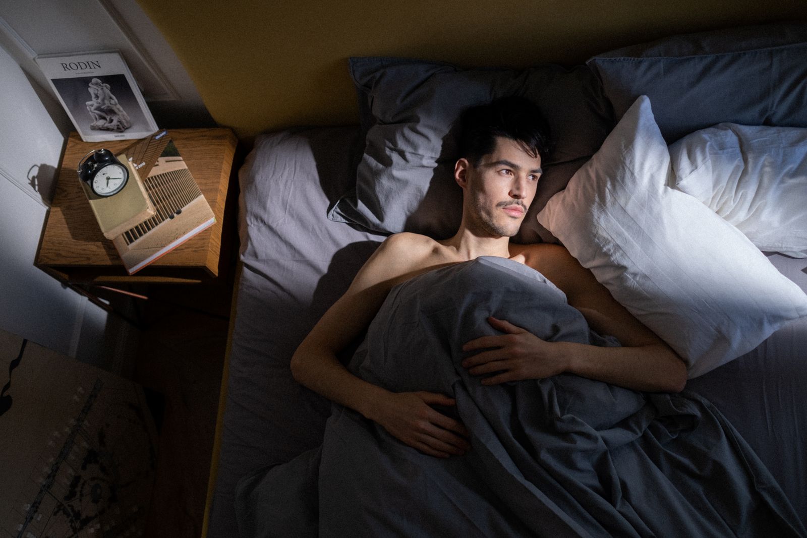 A calm, comfortable bedroom in soft morning light