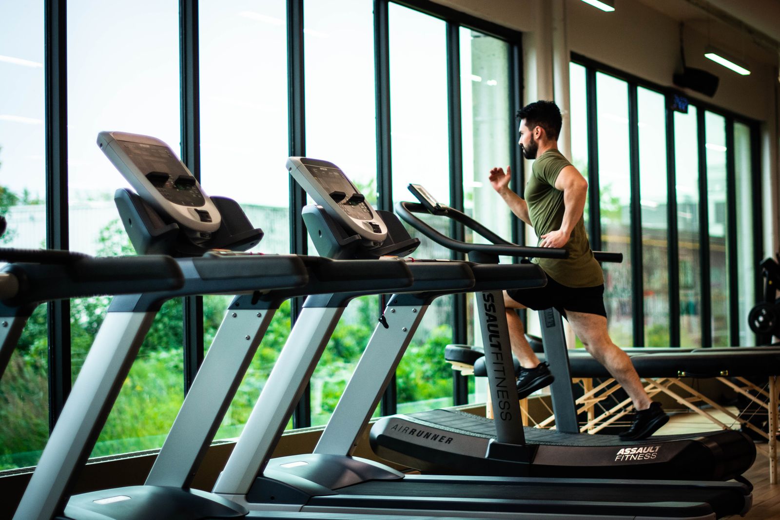 Person walking on a compact treadmill in a small home space
