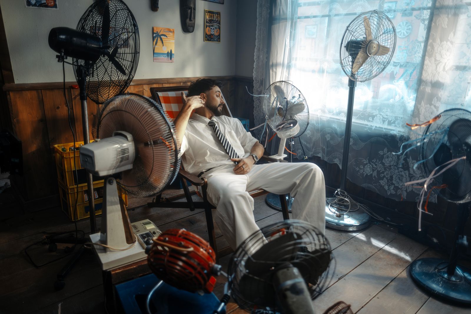Multiple electric fans arranged in a vintage-style room