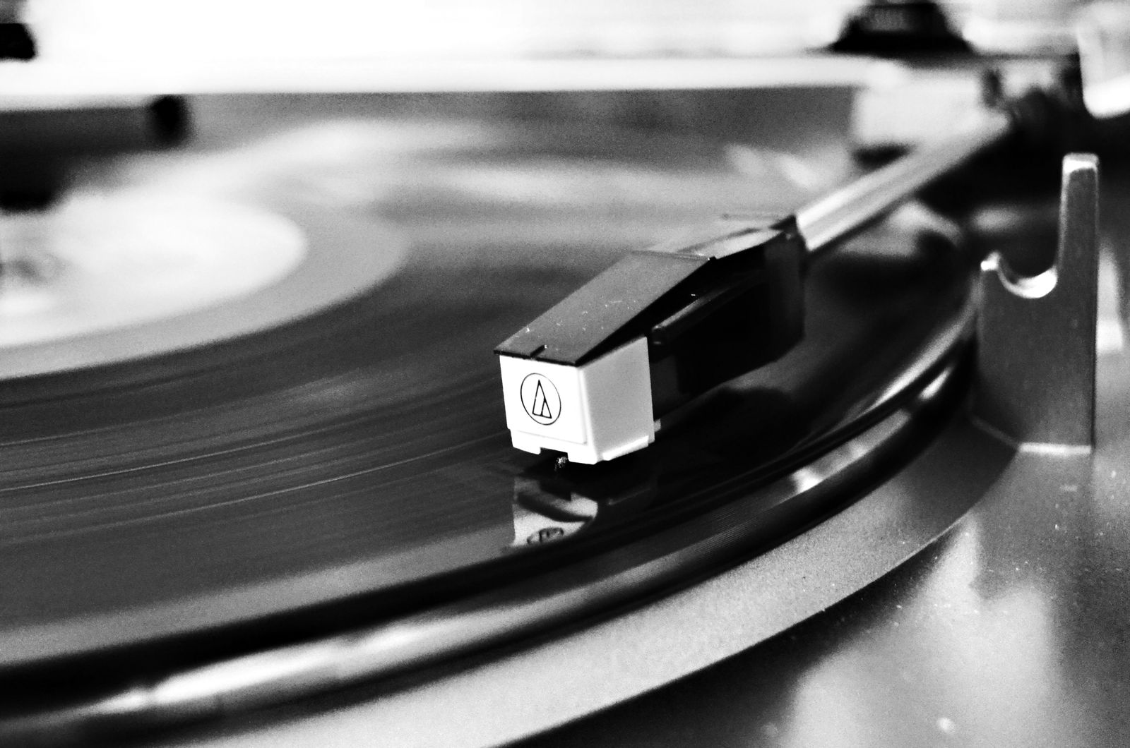 A vinyl record spinning on a turntable